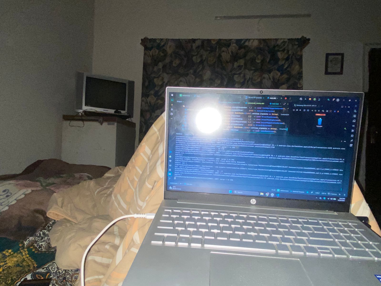 Late night coding session on laptop — building TankerNow